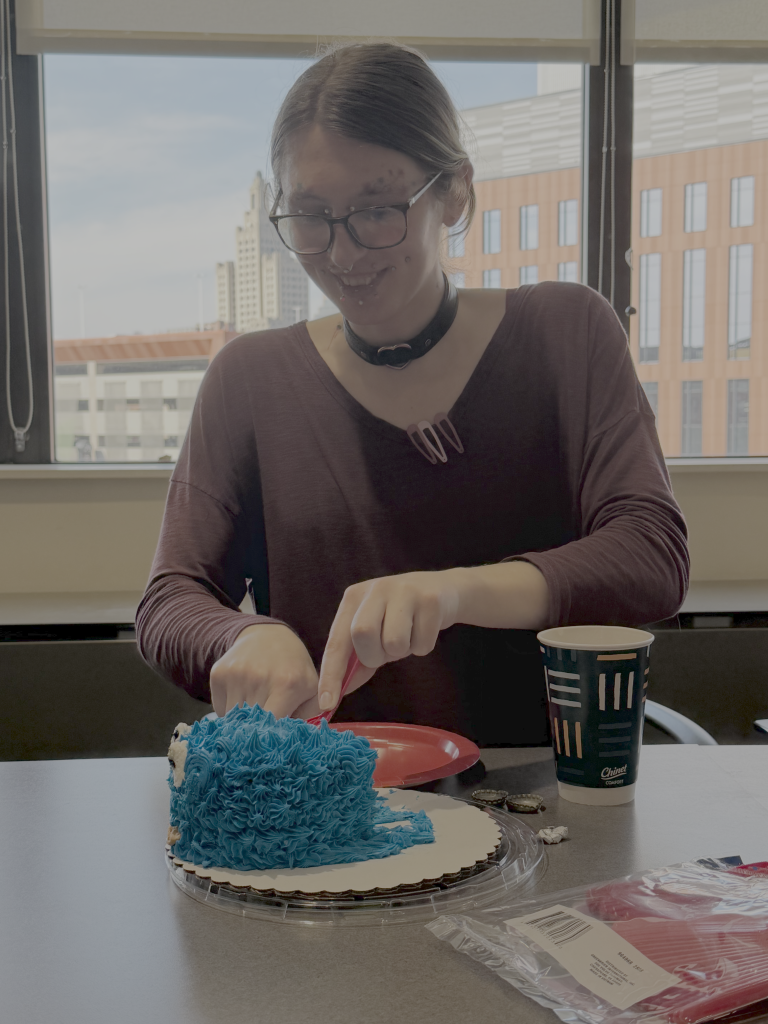 Aurora celebrates her successful thesis defense.